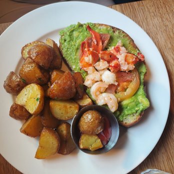 Earls Kitchen + Bar - Shrink and lobster bennedict with the eggs on the side. - New American Near Me - Orlando, Florida