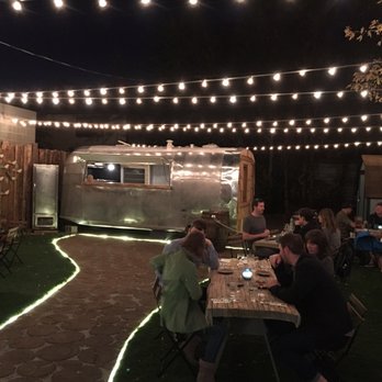 River and Woods - Outdoor patio at night. - New American Near Me - Boulder, Colorado River and Woods - Outdoor patio at night. - New American Near Me - Boulder, Colorado