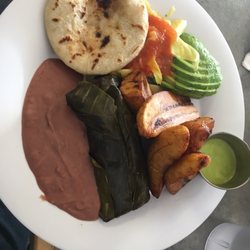 Combo plate with papusa, tamal, and plantains