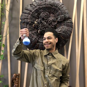 Light Cellar - a smiling man holding a blue flask - Specialty Food Near Me - Calgary, Alberta Light Cellar - a smiling man holding a blue flask - Specialty Food Near Me - Calgary, Alberta