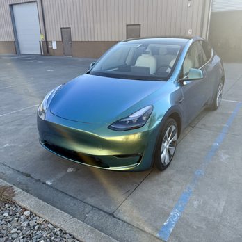 Robust Paint Protection & Auto Detailing - Full Colored Paint Protection Film (PPF) color flip Jungle Green wrap on Tesla Model Y at our shop. - Auto Detailing Near Me - Napa, California Robust Paint Protection & Auto Detailing - Full Colored Paint Protection Film (PPF) color flip Jungle Green wrap on Tesla Model Y at our shop. - Auto Detailing Near Me - Napa, California