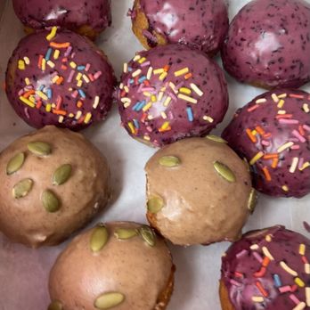 Twice Baked Baking Company - Vegan glazed Blueberry donut holes (half with sprinkles) and pumpkin spice with pumpkin seeds! - Bakeries Near Me - Long Beach, California Twice Baked Baking Company - Vegan glazed Blueberry donut holes (half with sprinkles) and pumpkin spice with pumpkin seeds! - Bakeries Near Me - Long Beach, California