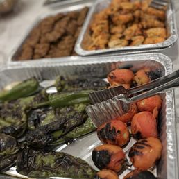 several trays of food on a table several trays of food on a table