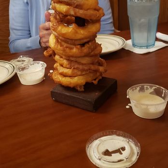 Clementine's - A stack of onion rings. This is a full, 12 inch stack and ranch dipping sauce. There is a half stack option, too. - American Near Me - South Haven, Michigan Clementine's - A stack of onion rings. This is a full, 12 inch stack and ranch dipping sauce. There is a half stack option, too. - American Near Me - South Haven, Michigan