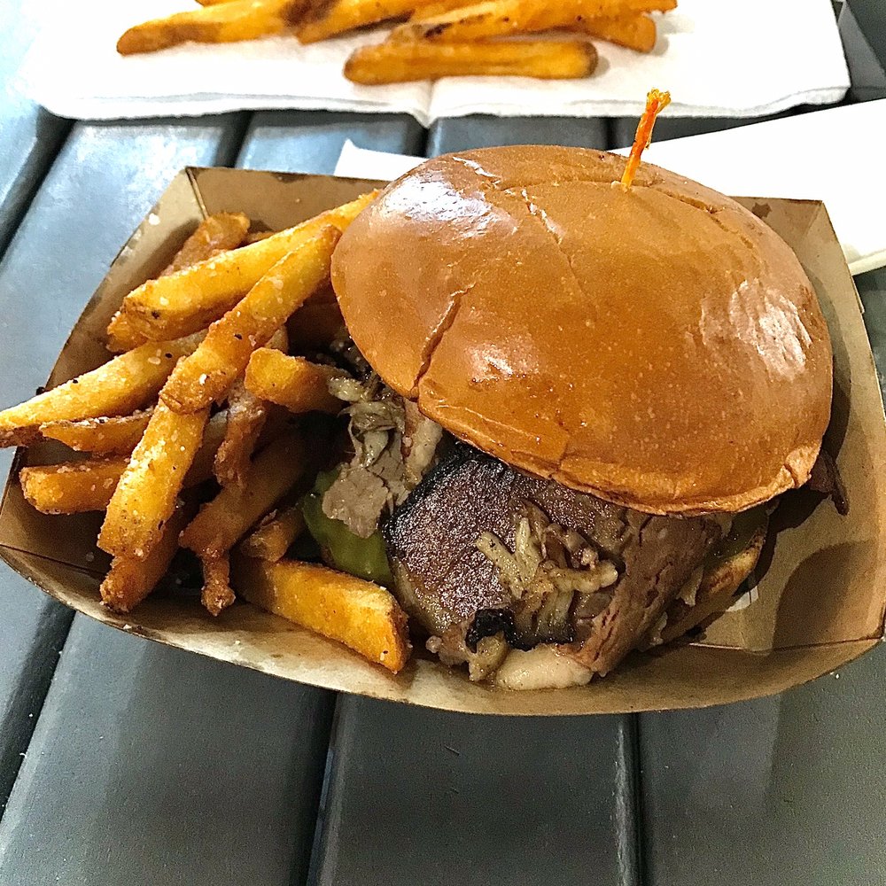 Brisket Sandwich w/ pickles and onions side of Fries. Brisket Sandwich w/ pickles and onions side of Fries.
