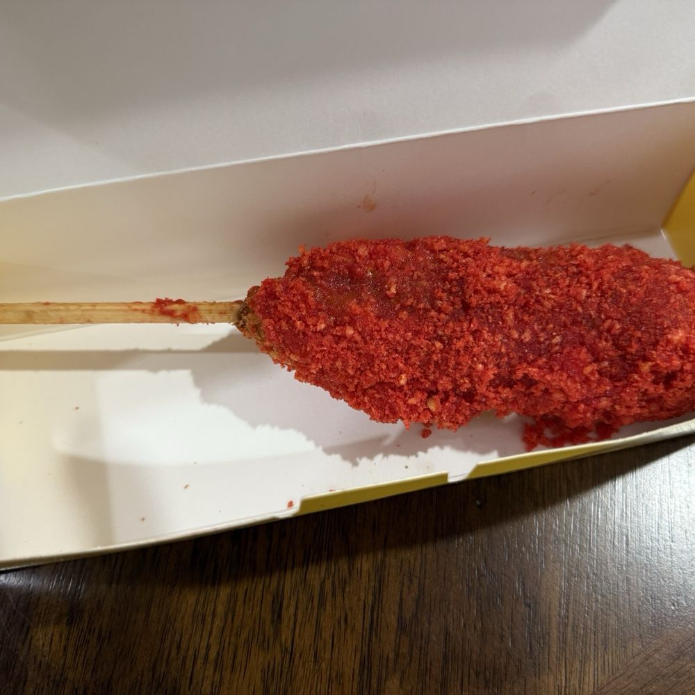 Mochinut - All beef corn dog breaded with Flaming Hot Cheetos. - Donuts Near Me - Reno, Nevada