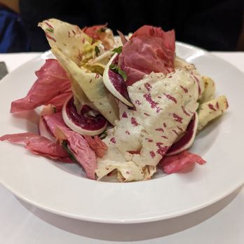 Jupiter - INSALATA DI STAGIONE  winter leaves with poached quince, Ubriaco and crushed hazelnuts - Italian Near Me - New York, New York