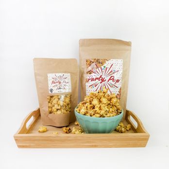 PartyPop Popcorn - two bags of popcorn and a bowl of popcorn - Popcorn Shops Near Me PartyPop Popcorn - two bags of popcorn and a bowl of popcorn - Popcorn Shops Near Me