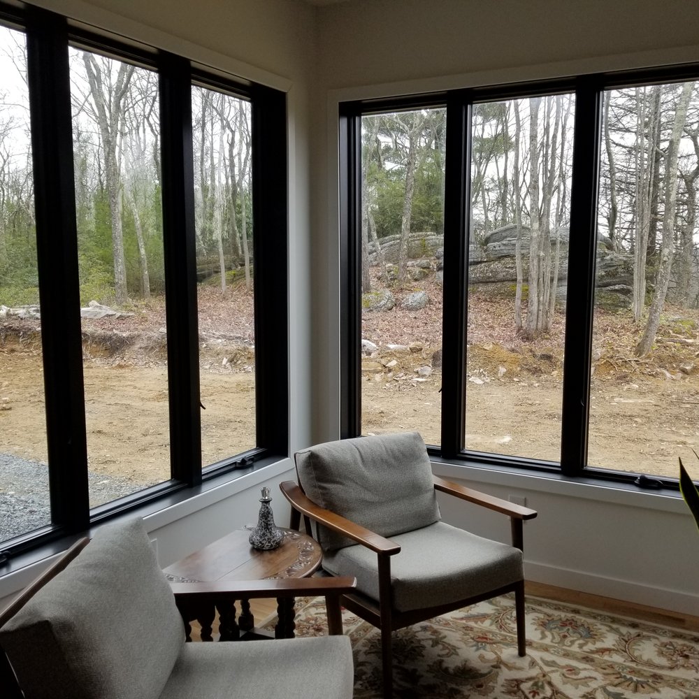 Michael Cataldo Builders - a living room with large windows - General Contractors Near Me - Jim Thorpe, Pennsylvania