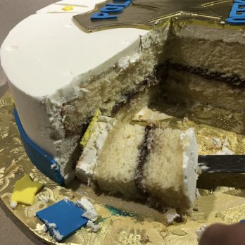 Cake Studio NYC - a slice taken out of a cake - Custom Cakes Near Me