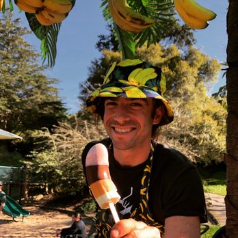 The Cocoabanana - a man holding a banana ice cream - Desserts Near Me The Cocoabanana - a man holding a banana ice cream - Desserts Near Me