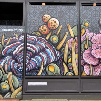 Pioneer Square - Decorated protective boards on a business - By Wakuda Studio - Parks Near Me - Seattle, Washington