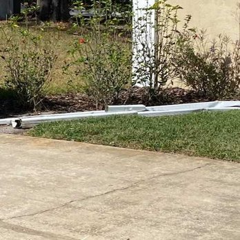 Universal Roof And Contracting - Dumped old gutter parts in yard and left them - Roofing Near Me - Orlando, Florida