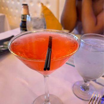 The Cuban - a woman sitting at a restaurant table - Cuban Near Me - Patchogue, New York