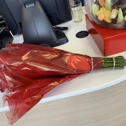 a bouquet of flowers and a phone a bouquet of flowers and a phone