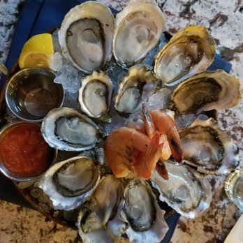 Taylor Shellfish Oyster Bar - Shuckers dozen. Variety of oysters.  SO good to taste different oysters. - Seafood Near Me - Seattle, Washington