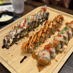 Sushi rolls - mountain roll, spicy girl roll, and Snow White roll.