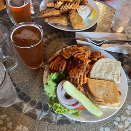 Fish sandwich and strong ale (front), fish and chips and wheat ale behind Fish sandwich and strong ale (front), fish and chips and wheat ale behind