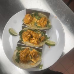 Touchdown Restaurant & Bar - Elote Crusted Shrimp tacos comes with a side of salsa red or green .