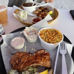 Lightly blackened grouper basket (yellow rice and slaw) and lightly blackened scallop basket (baked beans and slaw). Lightly blackened grouper basket (yellow rice and slaw) and lightly blackened scallop basket (baked beans and slaw).