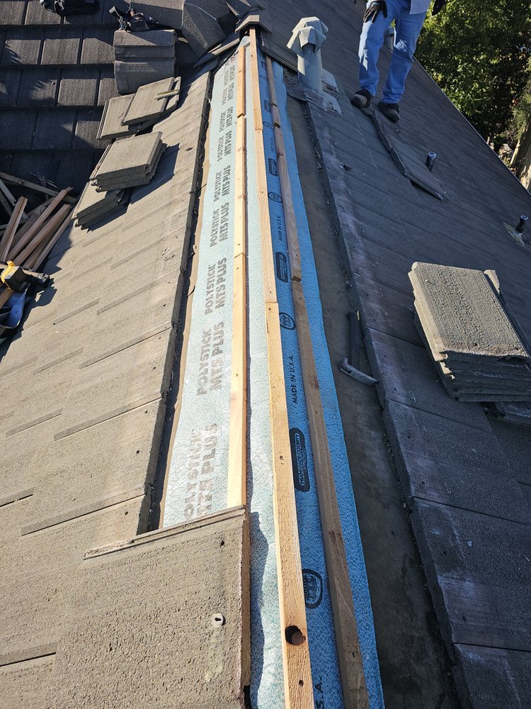 Slide of Arbiter Roofing