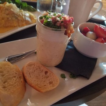 Teaspoon - Incredible egg parfait! Smooth, creamy potato purée topped w/ a perfectly runny egg, green onion and crispy bacon. Served w/crostini & fruit - Breakfast & Brunch Near Me - Tucson, Arizona
