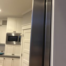 Hattan's Appliance Repair - Photo shows trim NOT installed properly. Trim is at an angle to the wall/not flush with wall at the bottom of trim piece.