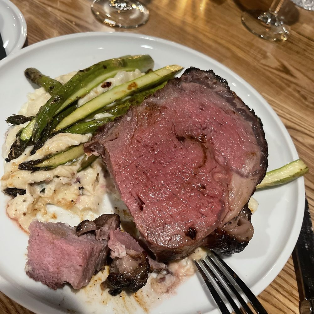 Rare 3001 - a plate of meat and asparagus - Steakhouses Near Me - Rochester, New York Rare 3001 - a plate of meat and asparagus - Steakhouses Near Me - Rochester, New York