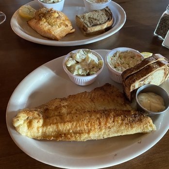 Manor On Main - Seafood stuffed salmon with potato salad top plate. Pan fried walleye and potato salad bottom plate. - Steakhouses Near Me - Wausaukee, Wisconsin