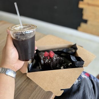 Uncharted Adventures Cafe - Colado on ice accompanied by a Raspberry chocolate cake - Coffee & Tea Near Me - Bakersfield, California Uncharted Adventures Cafe - Colado on ice accompanied by a Raspberry chocolate cake - Coffee & Tea Near Me - Bakersfield, California