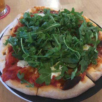Pacific Pizza & Brew - Ten inch margarita. Arugula piled on top. - Pizza Near Me - Bend, Oregon