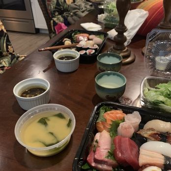 Love Sushi - Our to-go order spread out on our dining room table - Sushi Bars Near Me - Wenatchee, Washington