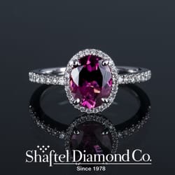 Shaftel Diamonds - Fine pink tourmaline diamond halo ring.
