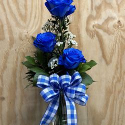 Arlene's Flowers & Gifts - Blue Rose Trio arranged in a vase with greenery and filler.
