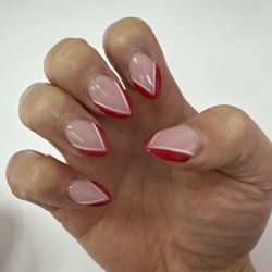 Elite Nails - Red and white almond shaped nails.