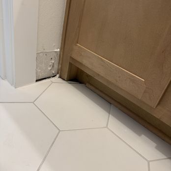 Water Damage Repair Tech - Removed trim to expose the wall for drying - Damage Restoration Near Me - Georgetown, Texas