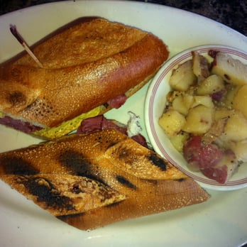 Shoop's - Somewhat burnt hot pastrami with swiss sandwich along with a side of german potato salad ($8.95) - Delis Near Me - Santa Monica, California Shoop's - Somewhat burnt hot pastrami with swiss sandwich along with a side of german potato salad ($8.95) - Delis Near Me - Santa Monica, California
