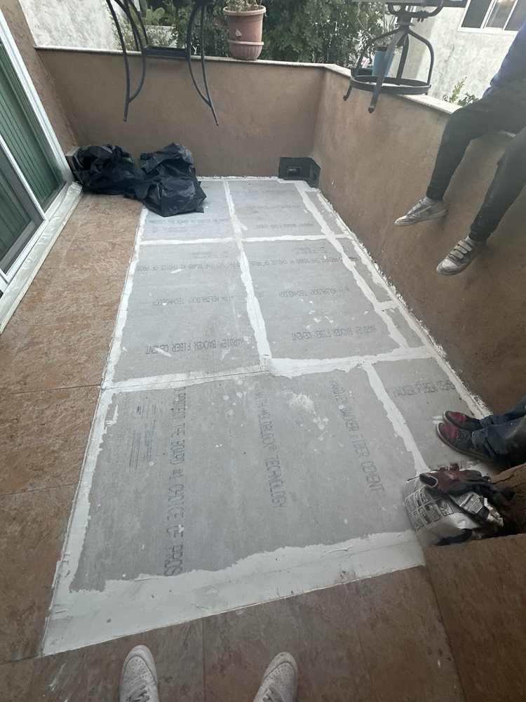 Slide of T’s Roofing 