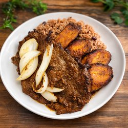 Palomilla a la plancha with onions, congri & sweet plantains. A Cuban classic made fresh and full of flavor!