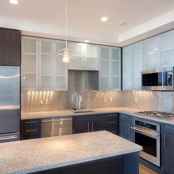 Penthouse Kitchens Feature Frosted Glass Cabinet Doors Quartz