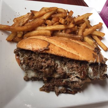 The Bad Apple - EVERY ROSE HAS ITS STEAK (thinly sliced steak, Four Roses bourbon onions, aged white cheddar, tangy steak sauce. on a hoagie bun) - Burgers Near Me - Chicago, Illinois
