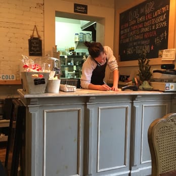 Mandy's - a woman standing at a counter in a restaurant - Salad Near Me - Montreal, Quebec