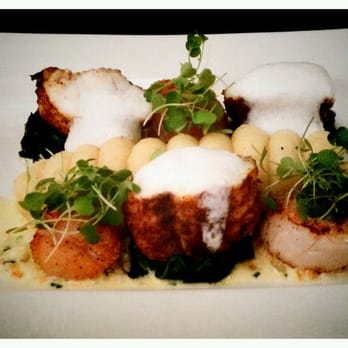 Castle Hotel - Tandoori roasted monkfish with a vanilla mash, sautéed scallops, buttered greens, brunoise cream sauce and coconut foam - £17.95 - Hotels Near Me - Conwy, CWY Castle Hotel - Tandoori roasted monkfish with a vanilla mash, sautéed scallops, buttered greens, brunoise cream sauce and coconut foam - £17.95 - Hotels Near Me - Conwy, CWY