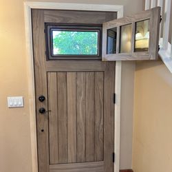 Ganahl Lumber - Custom built entry door. Solid walnut. Vented opening with screen.