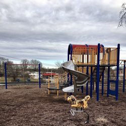 Royal Park - Part of the playground. The riding attraction in the foreground is missing part of its side.