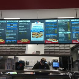 a man working behind the counter a man working behind the counter