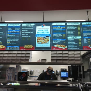 Domino's Pizza - a man working behind the counter - Pizza Near Me - Syracuse, Utah