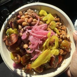 Jasmine rice, beans, cucumber/ tomato salad, teriyaki chicken, pickled onions, banana pepper