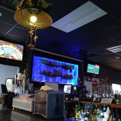 Desi Romano's Sports Bar & Grill - Cool bubble water feature vibe between kitchen and bar
