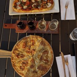 Pour Wine Bar & Bistro - Gluten Free Flat Bread and Wine Flight! (Regular flat bread included on white plate)